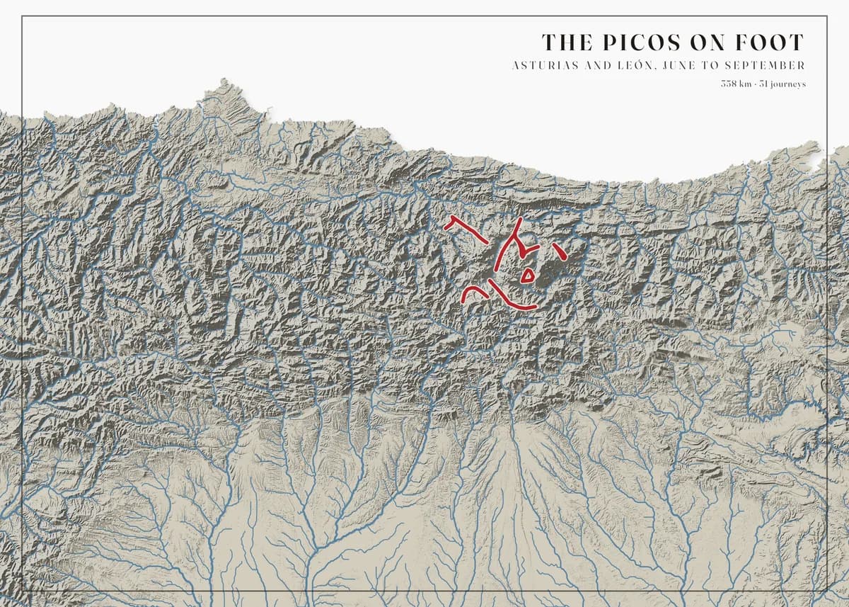 Landscape poster of the Cantabrian Mountains on a white background, the drainage network drawn in bold steel blue over soft grey relief — rivers running north to the sea and south onto the plain — with crimson walking routes in the Picos de Europa at the centre. The title reads The Picos on foot.