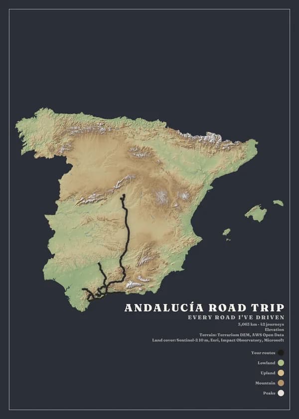 Portrait poster of Spain on dark slate paper. The country is cut out of the paper and coloured by elevation, from green lowlands through tan uplands to pale peaks, with shaded relief. A black route runs from the centre of the country south through Andalucía. The title reads Andalucía road trip, with a legend for routes, lowland, upland, mountain and peaks.