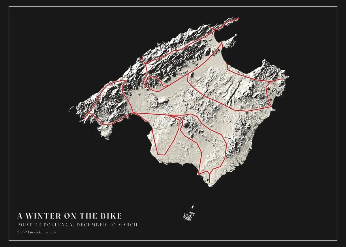Landscape poster of Mallorca on black paper, the island carved in a single pale plaster tone by light and shadow — the Serra de Tramuntana standing out along the north-west coast, the central plain smooth — with crimson riding loops over the mountain road and the plain. The title reads A winter on the bike.